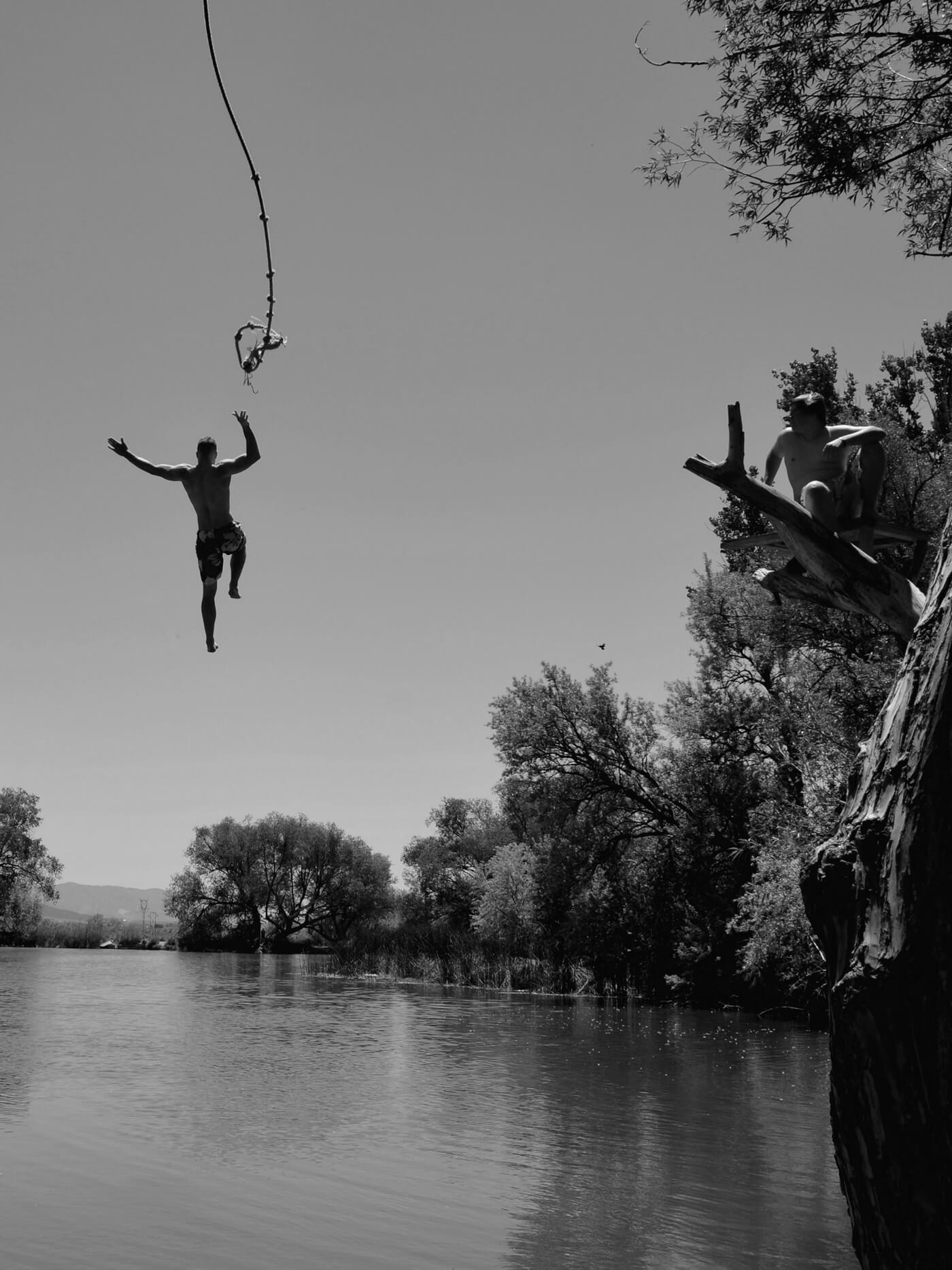 Father swinging into a lake — Troy Simmonds Father Son Weekend